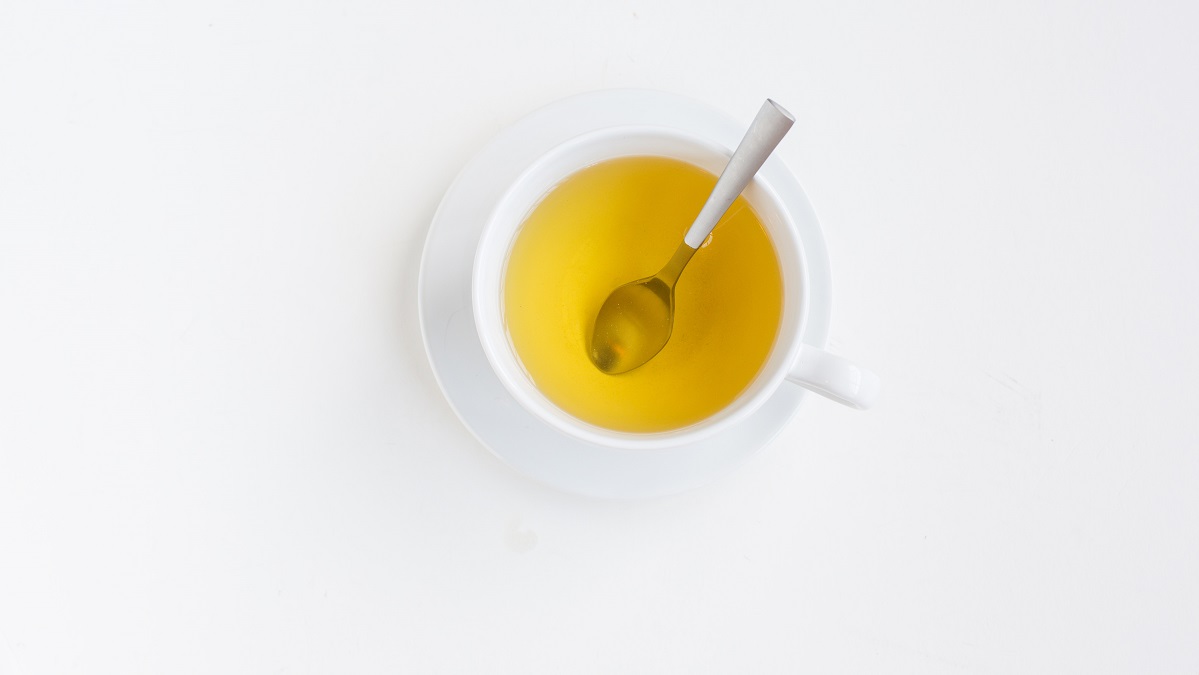 A cup of herbal tea with a spoon is good for dehydration