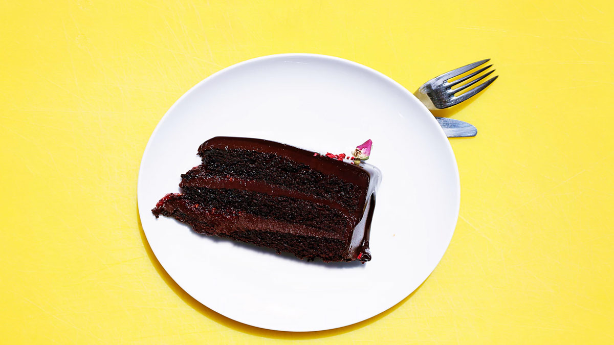 Slice of chocolate cake with ganache