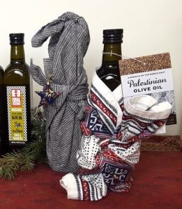 Equal Exchange Palestinian Olive Oil dressed up with a gift tag and wrapping