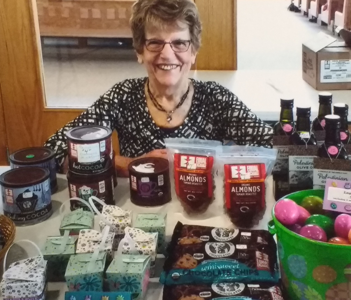 Kay Mackie of Monona United Methodist Church shows off her fair trade table