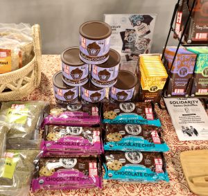a display of fair trade chocolate chips, cocoa and chocolate bars on a table