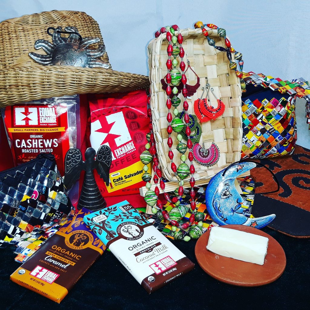 A collection of fairly traded food and crafts for sale on a table display